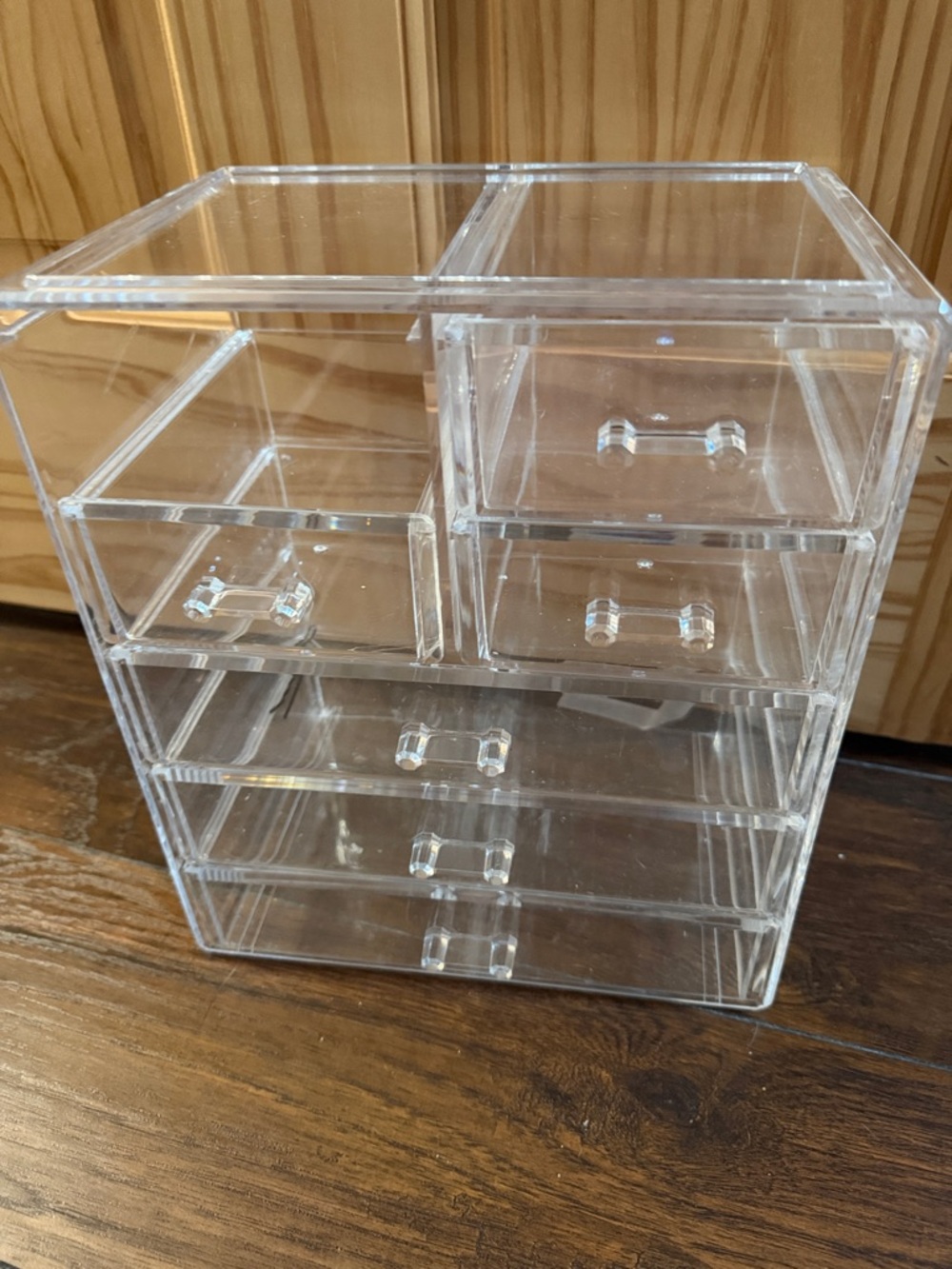 Clear plastic jewelry organizer.